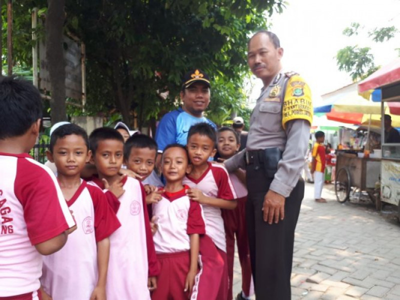 IMG-bhabinkamtibmas-laksanakan-program-polkiss-ke-sekolah-sdn-6-poris-gaga